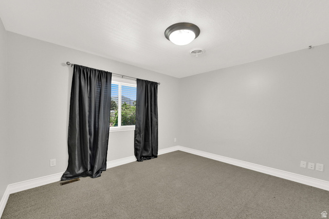 4792 Glasmann Way South Ogden, UT 84403 - Photo 53 of 70 Bedroom #3 carpeted room with light gray walls, white baseboards, and a single window
