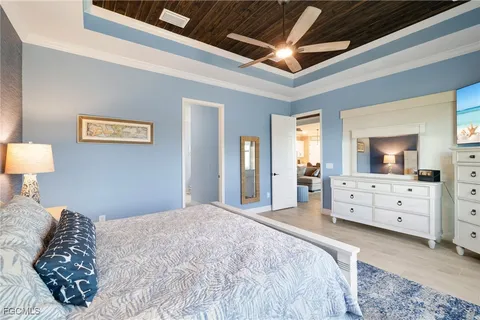 a bedroom with a large bed and dresser