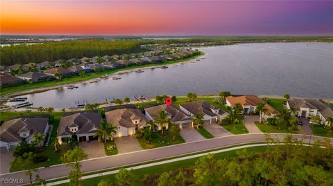 an aerial view of a house with a lake view
