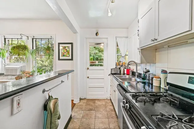 a kitchen that has a lot of cabinets in it