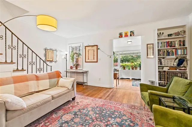 a living room with furniture and a rug