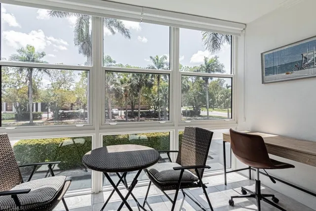a view of a dining room with furniture window and outside view