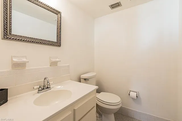 a room with a window a washer and dryer