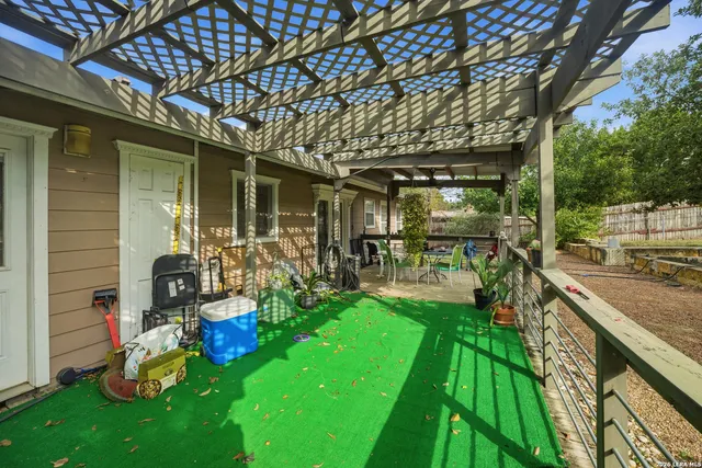 a view of a porch with furniture and garden