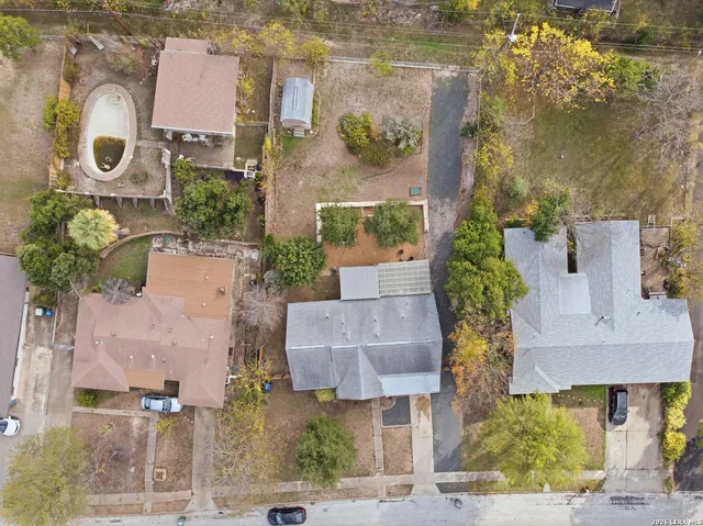 an aerial view of houses with outdoor space