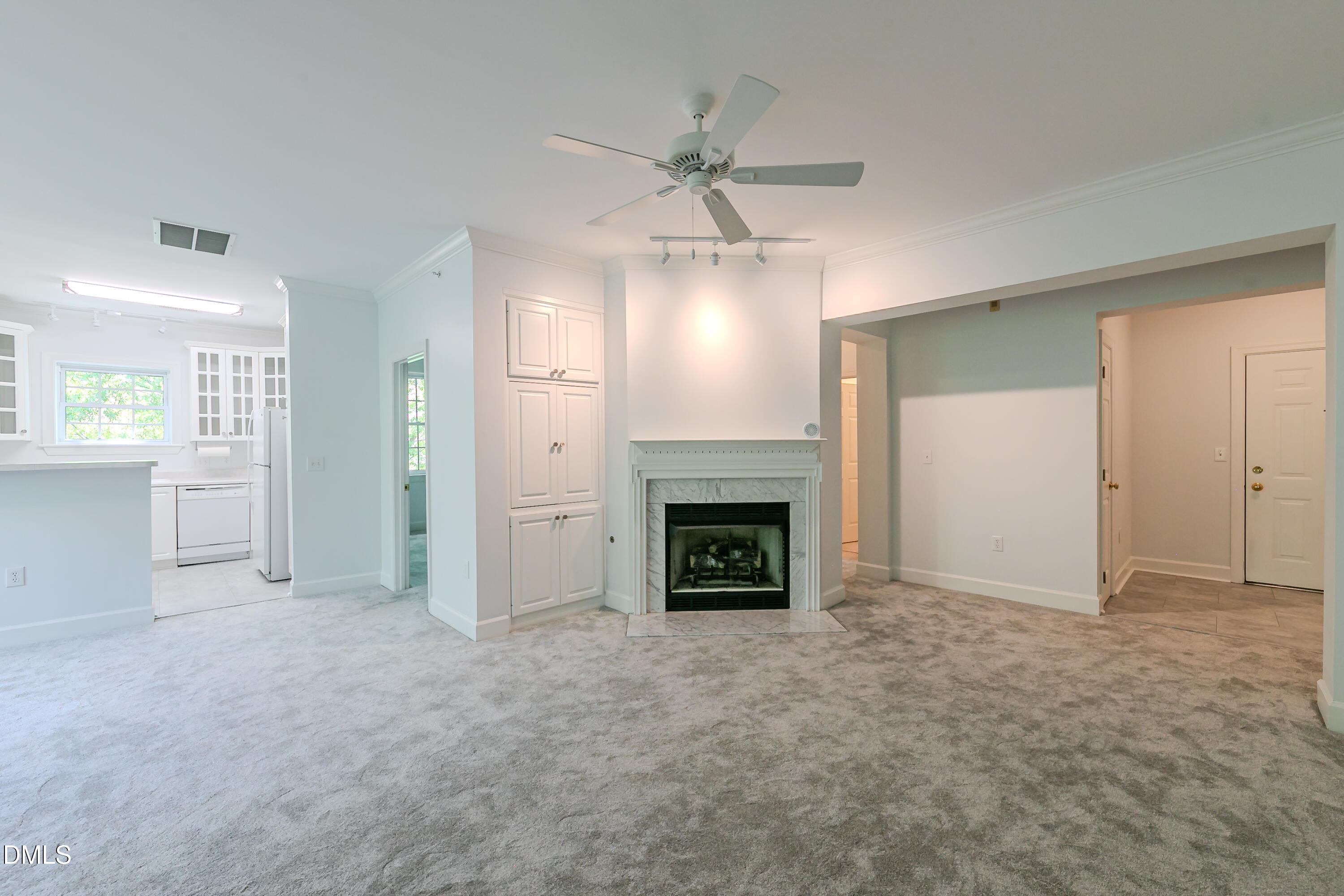 116 Northbrook Drive, Unit 305 Raleigh, NC 27609 - Photo 14 of 43 an empty room with windows and fireplace