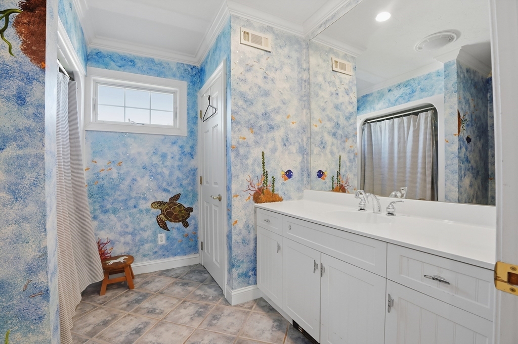 183 Whiting Street Hanover, MA 02339 - Photo 32 of 42 a bathroom with a sink and mirror