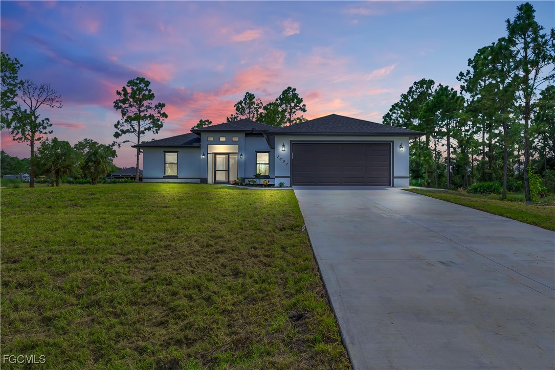 a front view of a house with a yard