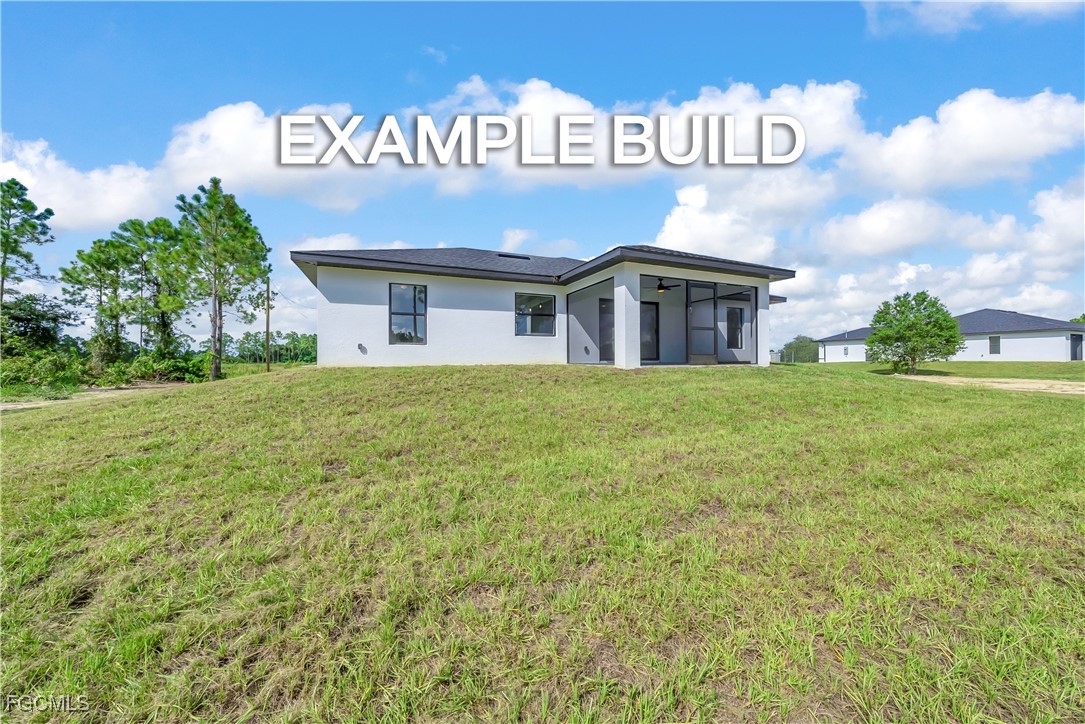 7602 18th Place LaBelle, FL 33935 - Photo 29 of 30 a view of a house with a yard