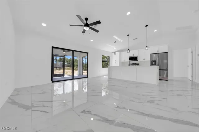 a view of a kitchen with a sink and a window