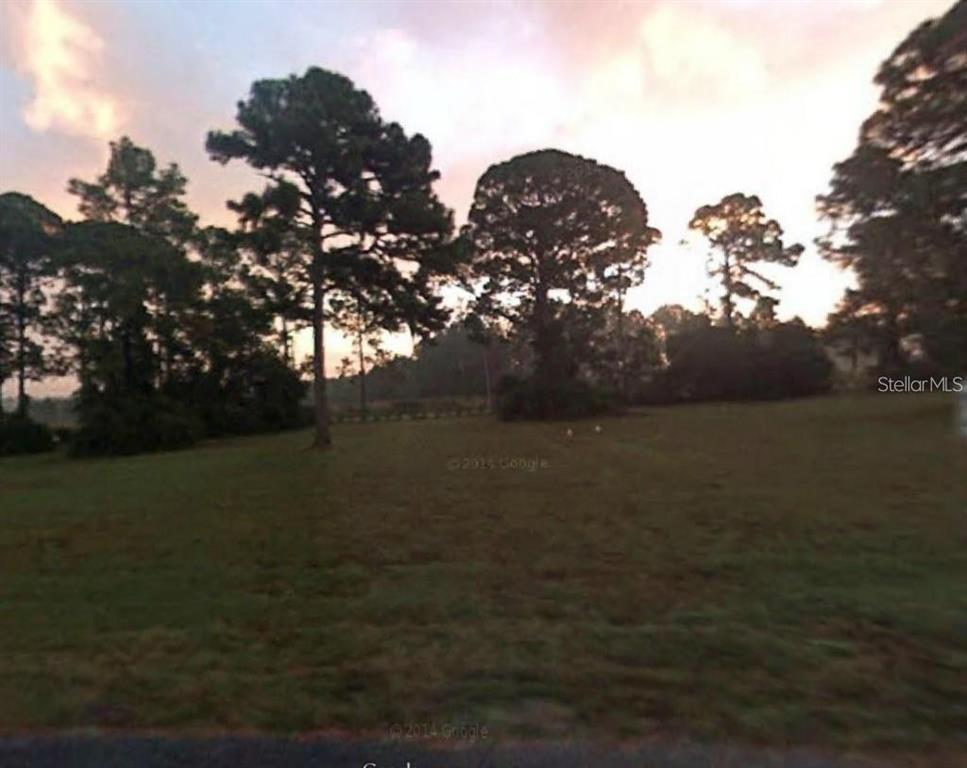 205 Sher Lane DeBary, FL 32713 - Photo 3 of 15 a view of lake with green space