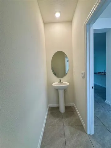 a view of a room with wooden floor and staircase