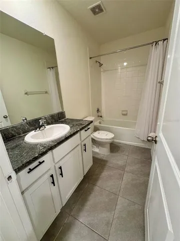 a view of a room with wooden floor and staircase