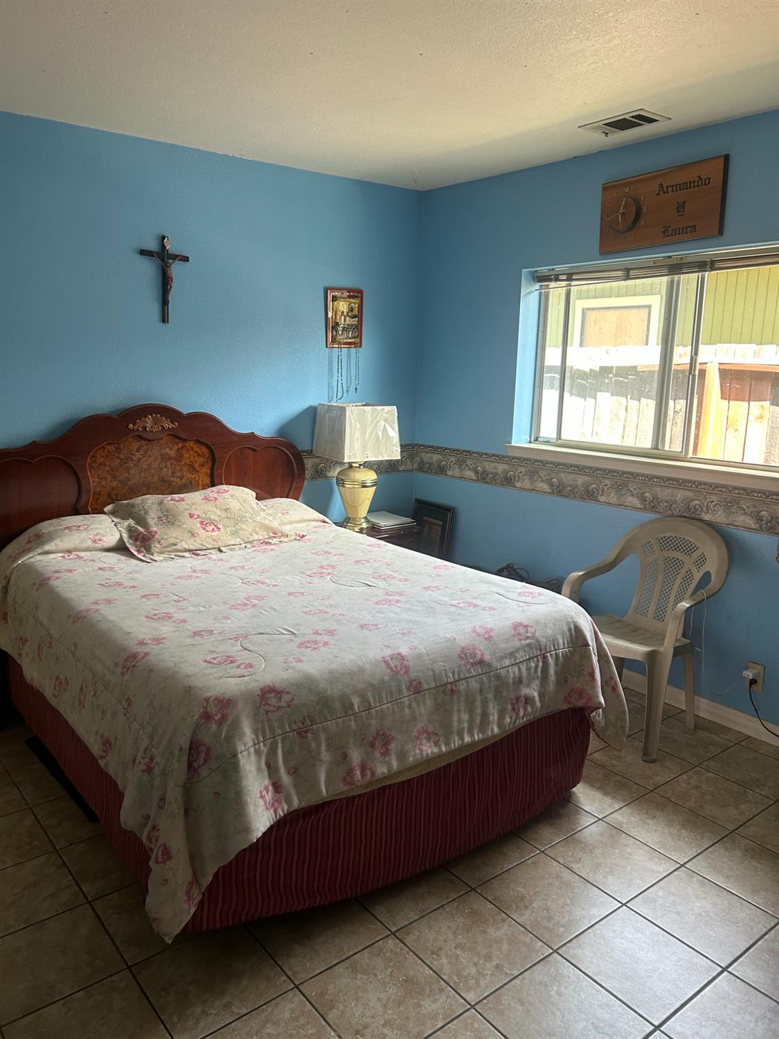 304 North Madison Street Modesto, CA 95351 - Photo 10 of 12 a bedroom with a bed and a table