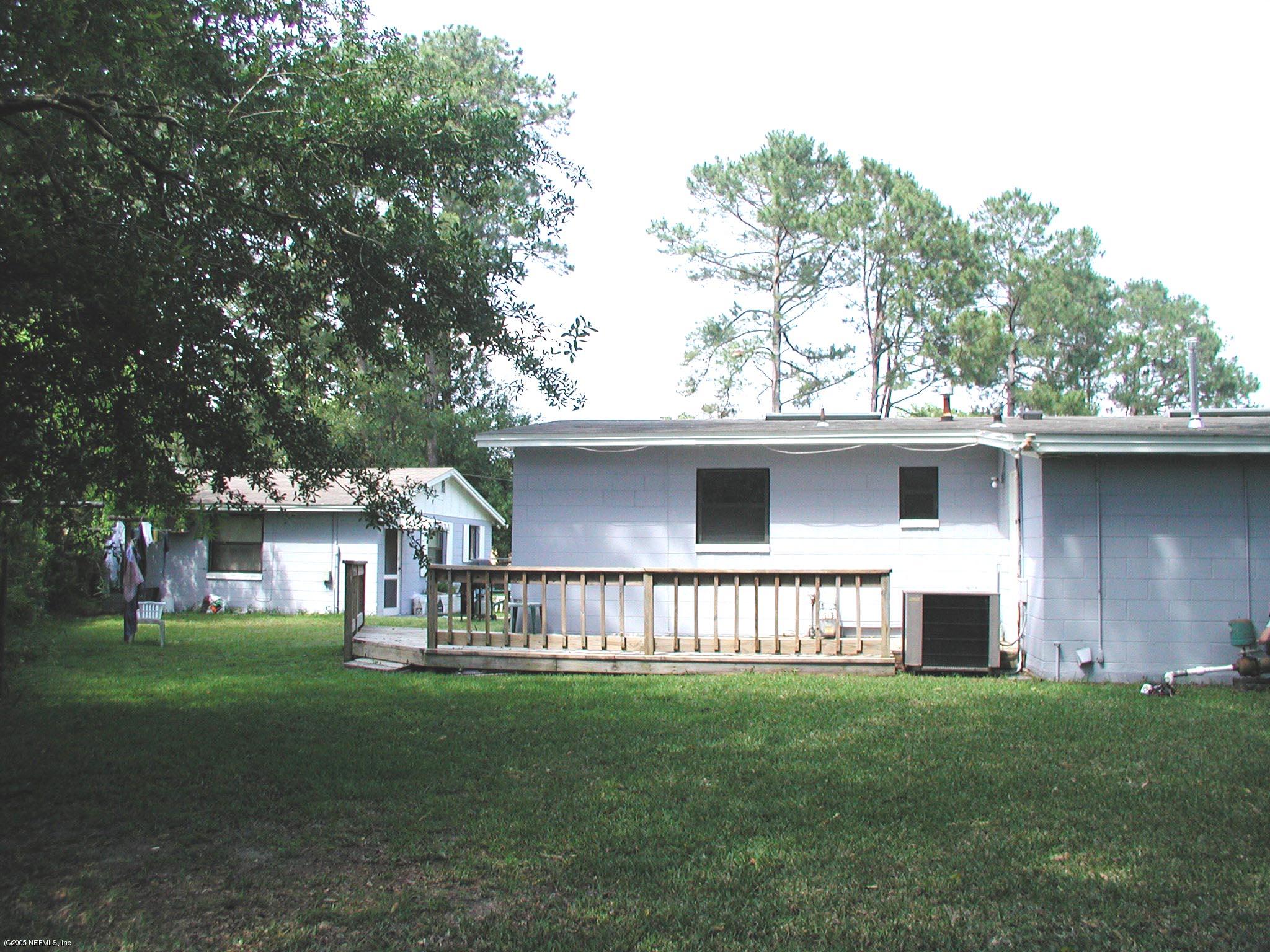 4450 Vinton Road Jacksonville, FL 32207 - Photo 5 of 5 a view of a house with a yard and sitting area