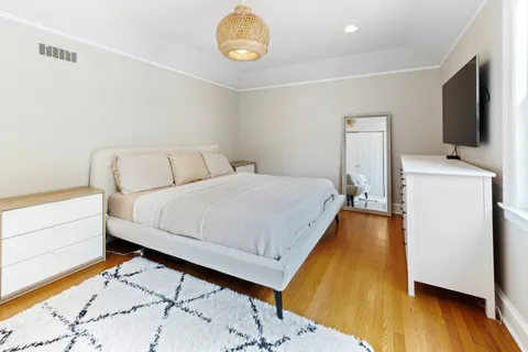 a bed room with a bed and a television