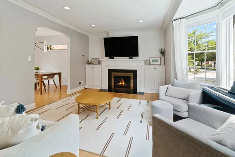 a living room with furniture fireplace and a flat screen tv
