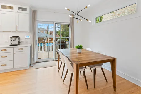 a view of a room with window and wooden floor