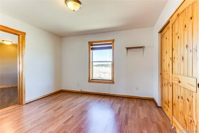 a view of front door with wooden floor