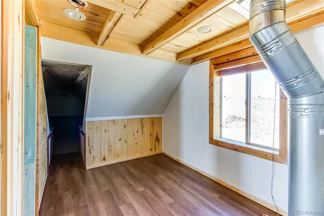 a view of balcony with wooden floor