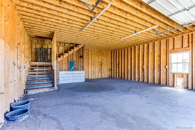 a view of a porch with wooden floor and stairs