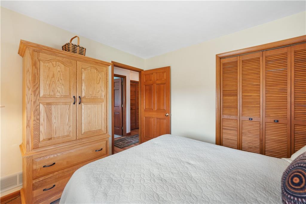317 Madison Heights Road Madison, PA 15672 - Photo 15 of 32 a bedroom with a bed and a closet