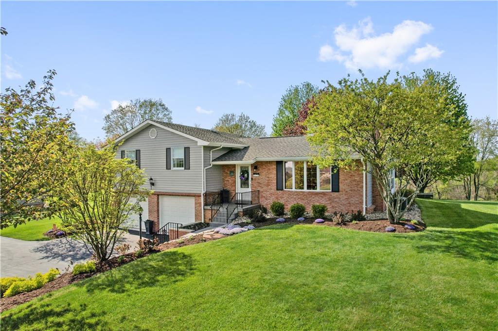 317 Madison Heights Road Madison, PA 15672 - Photo 2 of 32 a front view of a house with a yard