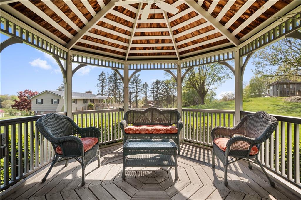 317 Madison Heights Road Madison, PA 15672 - Photo 27 of 32 a view of a chairs and table in patio with a fire pit