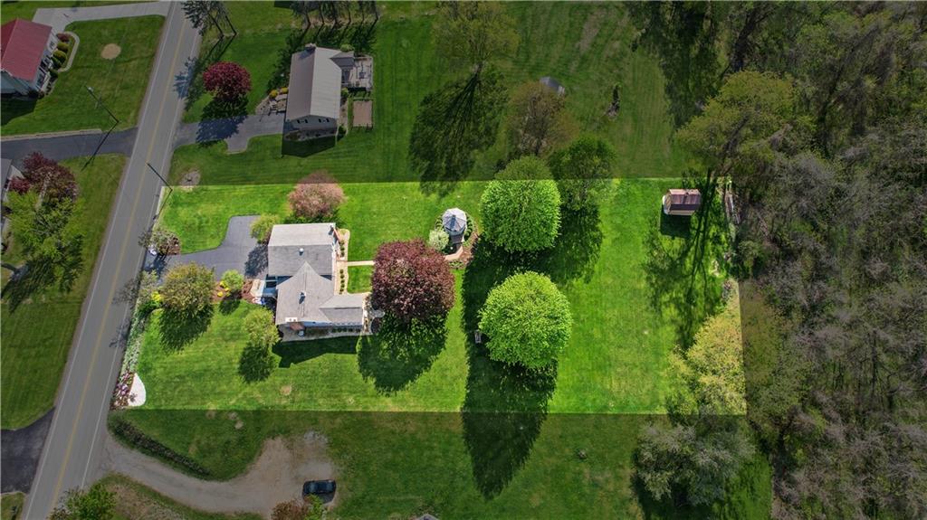 317 Madison Heights Road Madison, PA 15672 - Photo 30 of 32 an aerial view of a house with pool yard and outdoor seating