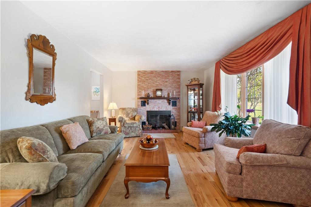 317 Madison Heights Road Madison, PA 15672 - Photo 6 of 32 a living room with furniture fireplace and a large window