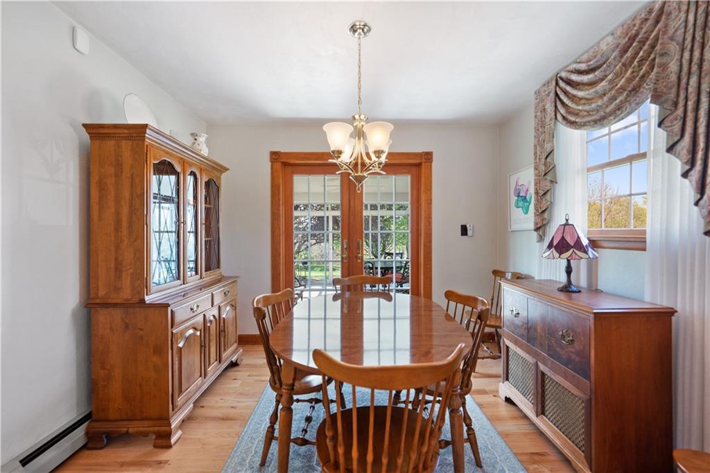 317 Madison Heights Road Madison, PA 15672 - Photo 9 of 32 a view of a dining room with furniture window and wooden floor