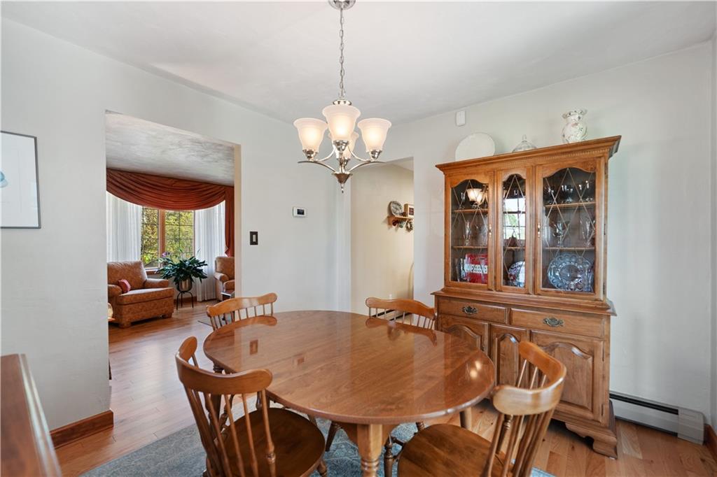 317 Madison Heights Road Madison, PA 15672 - Photo 10 of 32 a view of a dining room with furniture and a chandelier