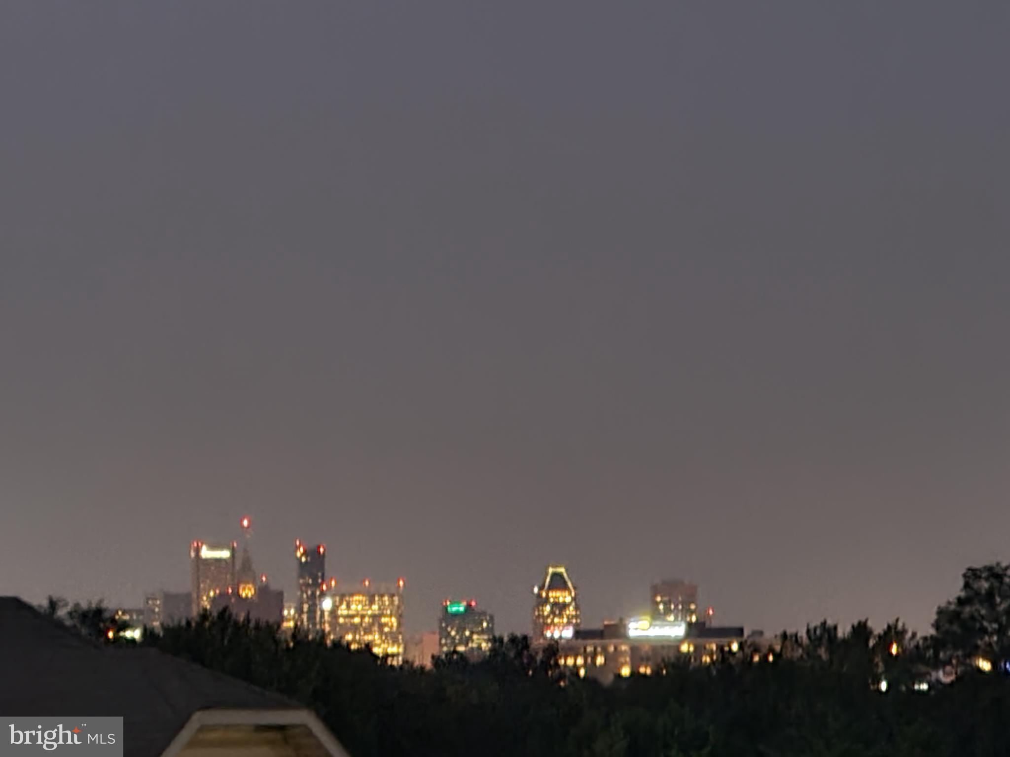 122 West Hilltop Road Baltimore, MD 21225 - Photo 13 of 32 Twilight view of the Harbor skyline
