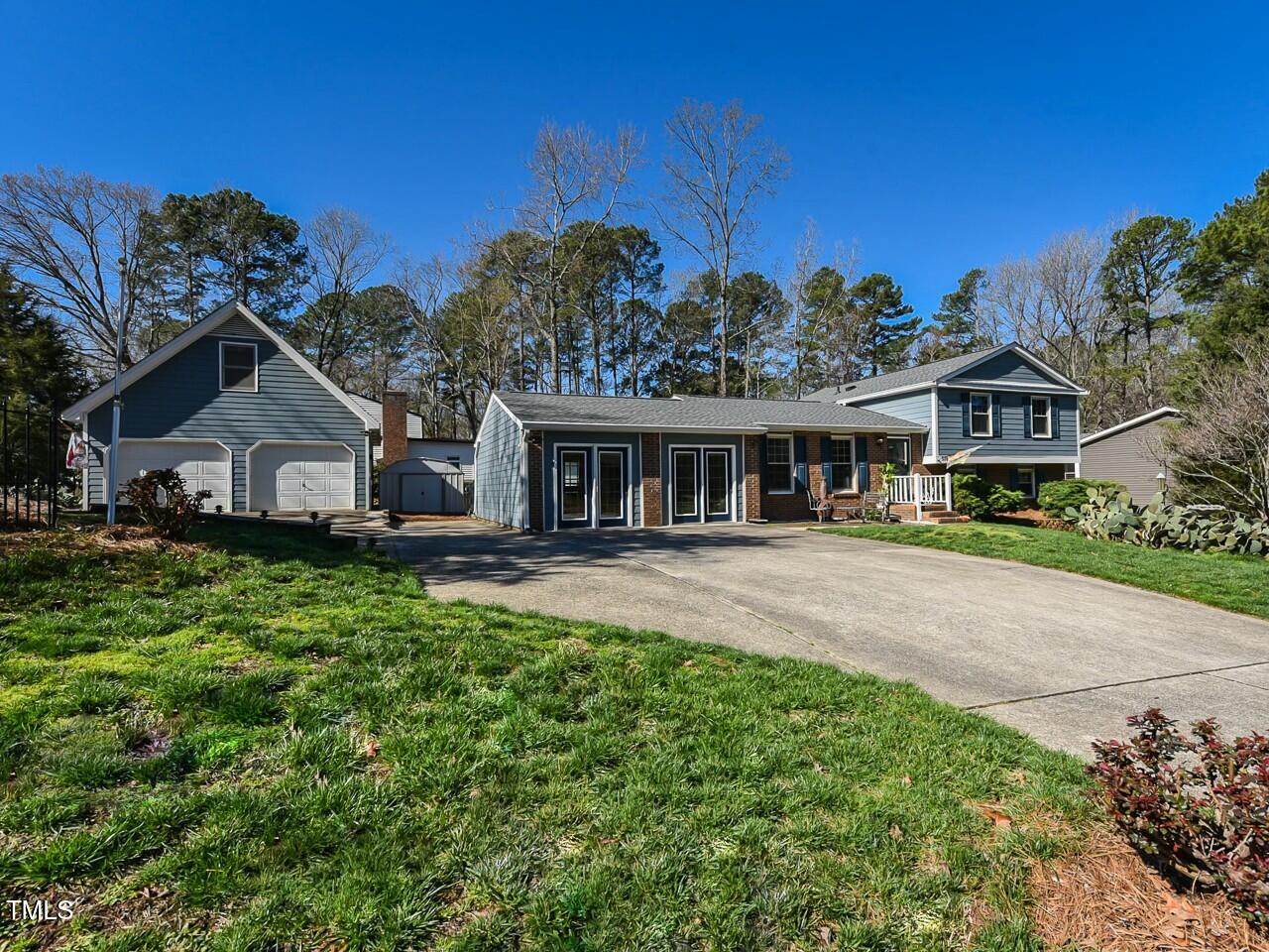 310 Electra Drive Cary, NC 27513 - Photo 1 of 45 a view of house with a big yard and potted plants