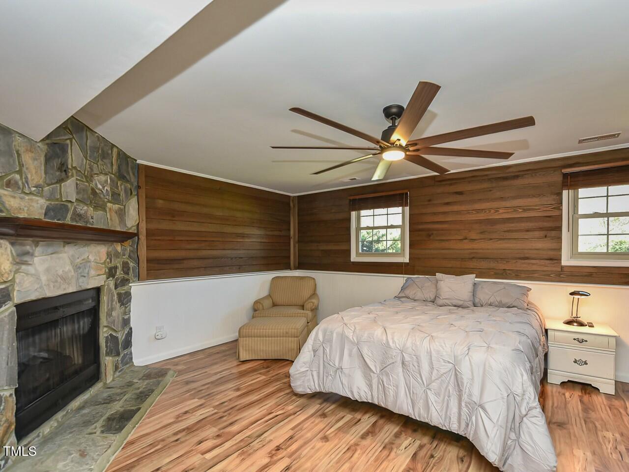 310 Electra Drive Cary, NC 27513 - Photo 18 of 45 a bedroom with a bed and a ceiling fan