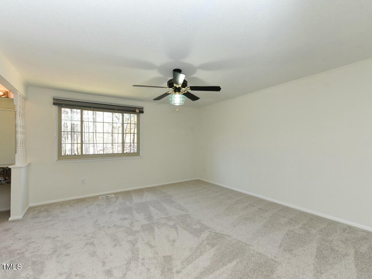 310 Electra Drive Cary, NC 27513 - Photo 27 of 45 an empty room with a window