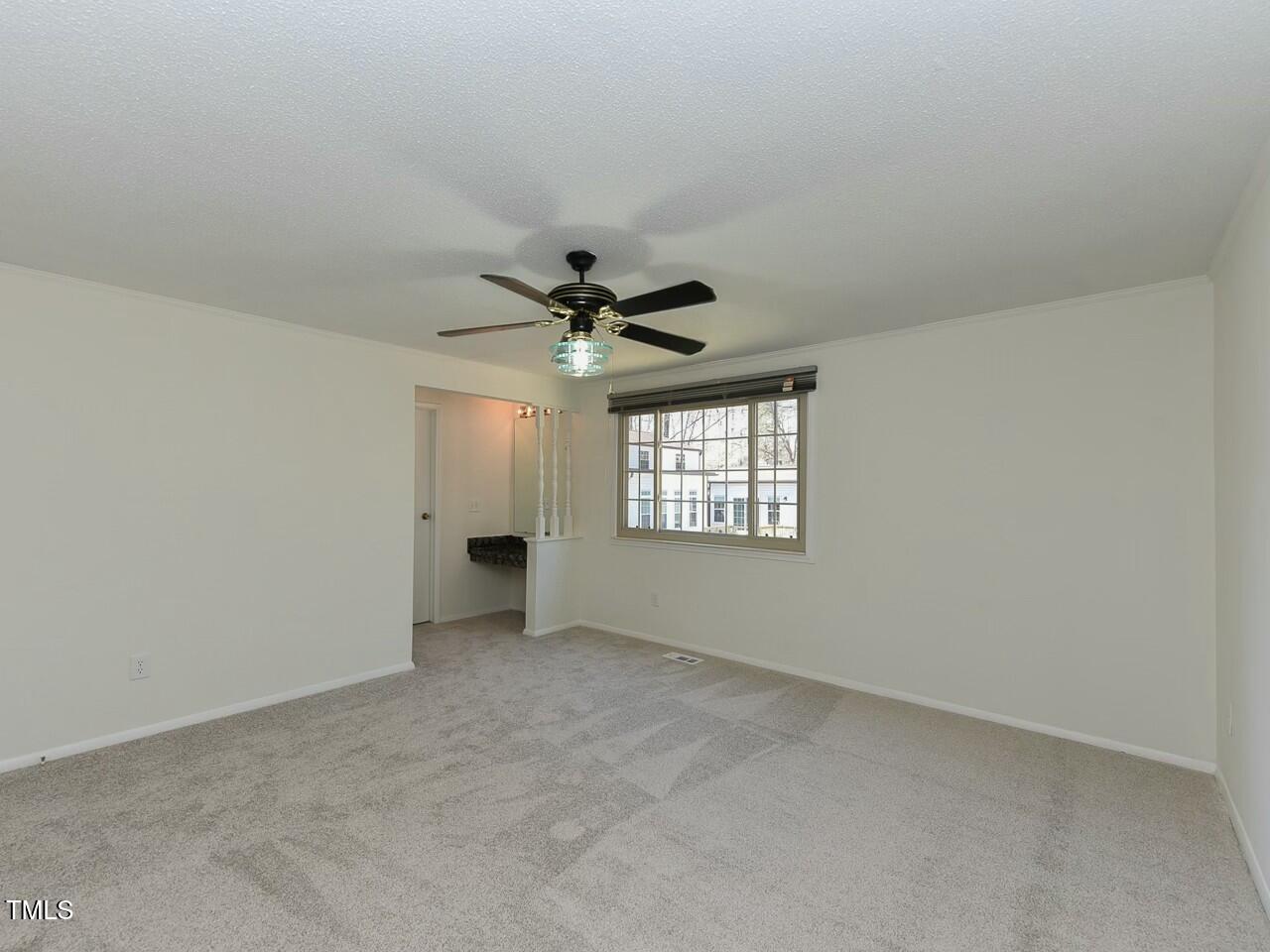 310 Electra Drive Cary, NC 27513 - Photo 28 of 45 a view of an empty room with a window