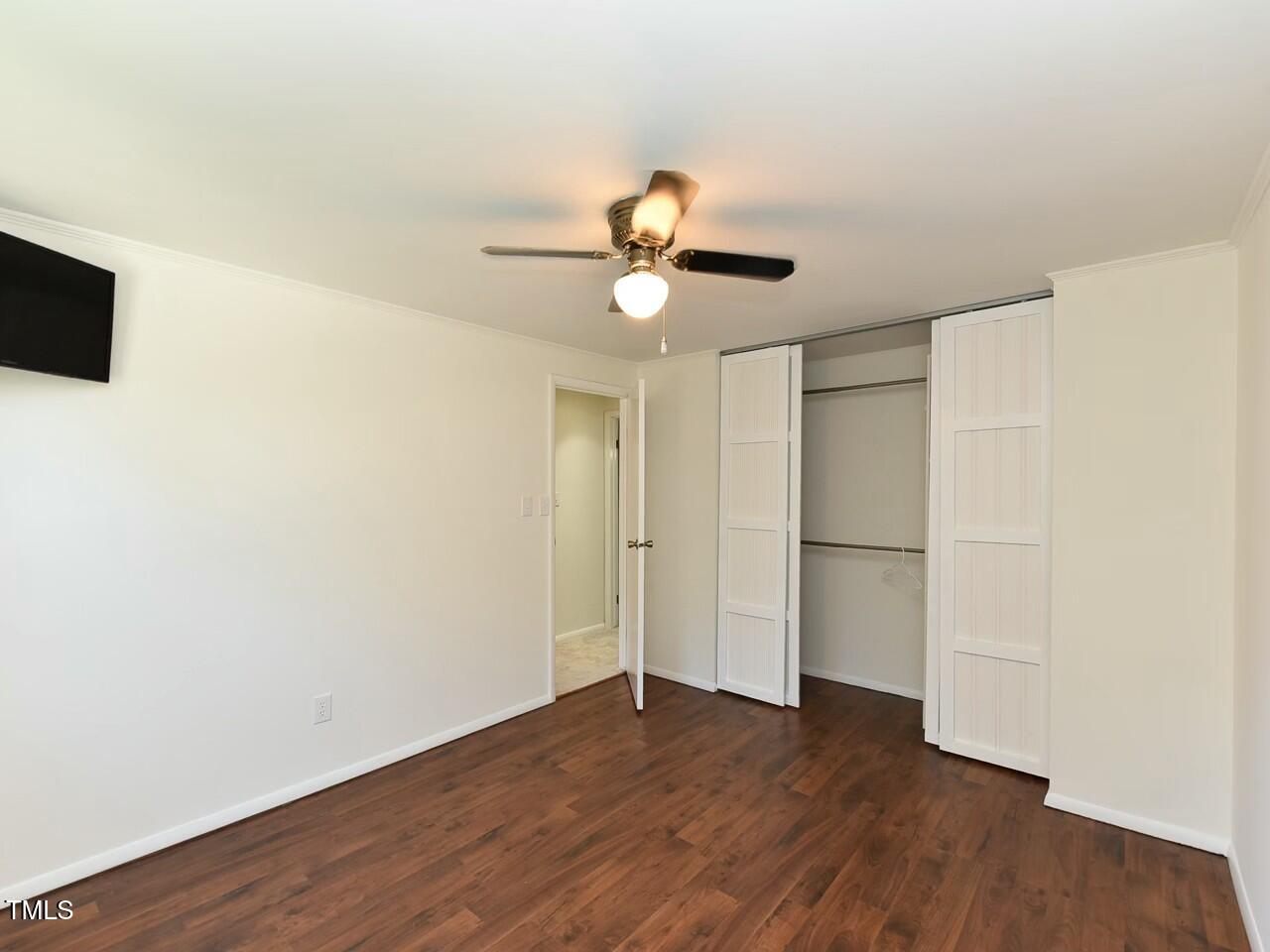 310 Electra Drive Cary, NC 27513 - Photo 31 of 45 a view of a room with wooden floor and a ceiling fan