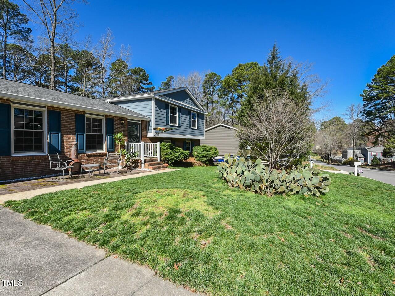 310 Electra Drive Cary, NC 27513 - Photo 4 of 45 a view of a house with backyard and sitting area