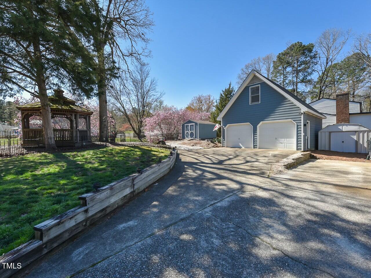 310 Electra Drive Cary, NC 27513 - Photo 41 of 45 a view of a house with a yard covered with snow in the background