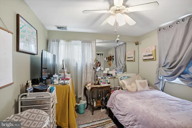 a bedroom with furniture and a chandelier