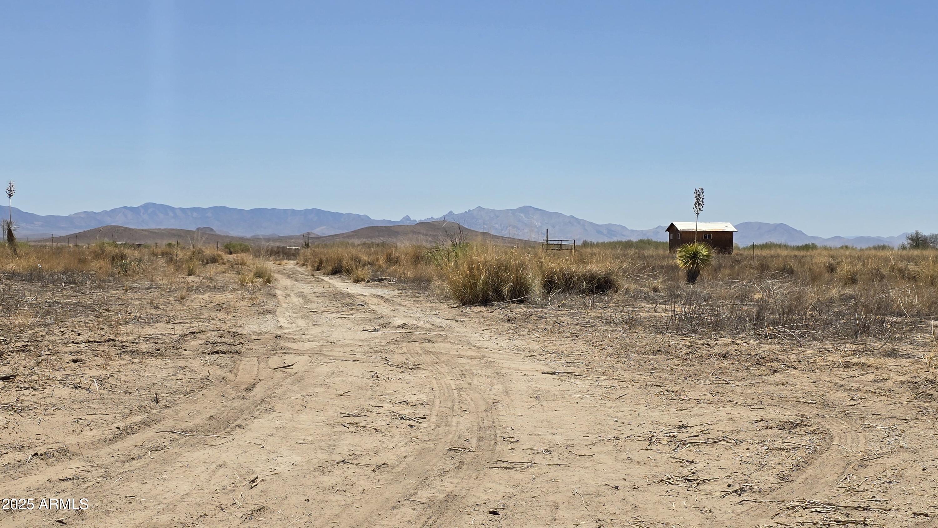 9.97-acres South Kit Carson Road, Unit 5 Pearce, AZ 85625 - Photo 13 of 22 a view of a mountain with an ocean view