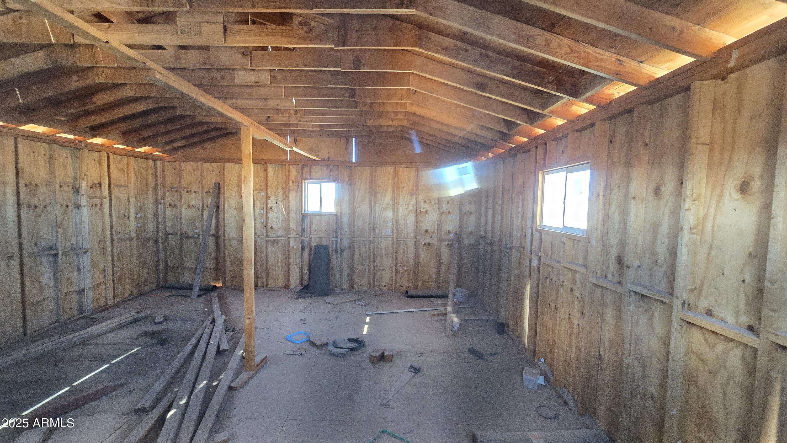 9.97-acres South Kit Carson Road, Unit 5 Pearce, AZ 85625 - Photo 6 of 22 a view of a room with wooden walls