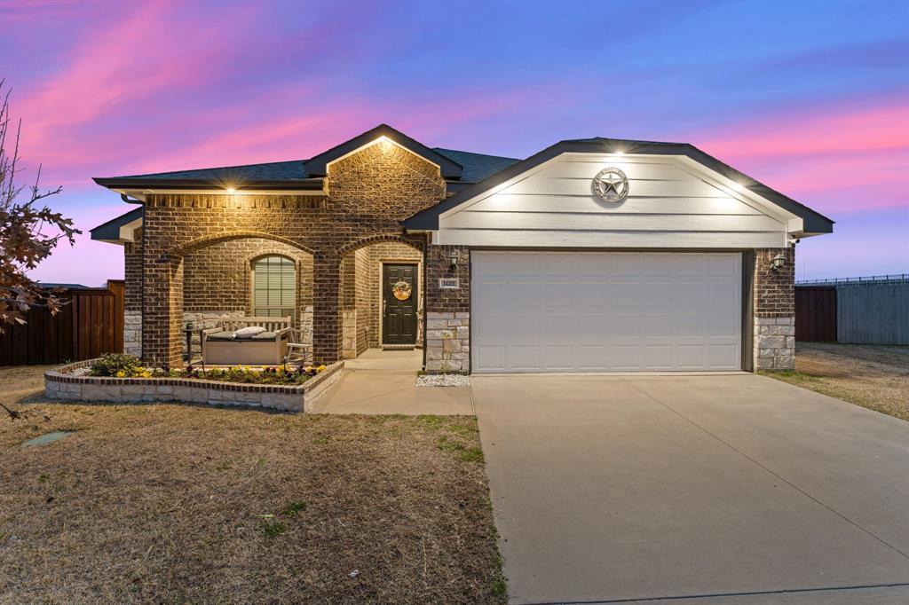 14201 Bridgeview Lane Dallas, TX 75253 - Photo 1 of 1 a front view of a house with parking area