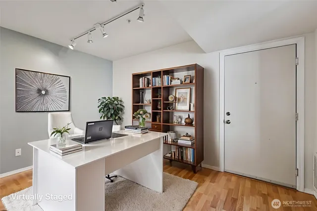 a workspace with furniture and wooden floor