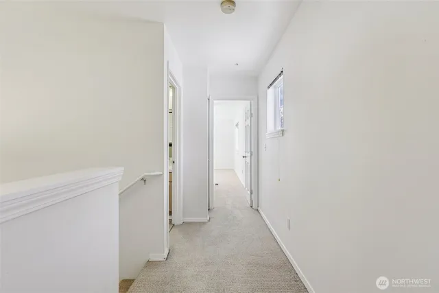 a view of a hallway with closet