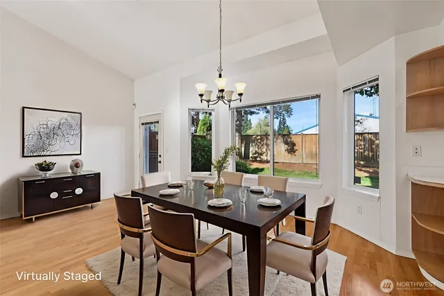 a view of a dining room with furniture and window