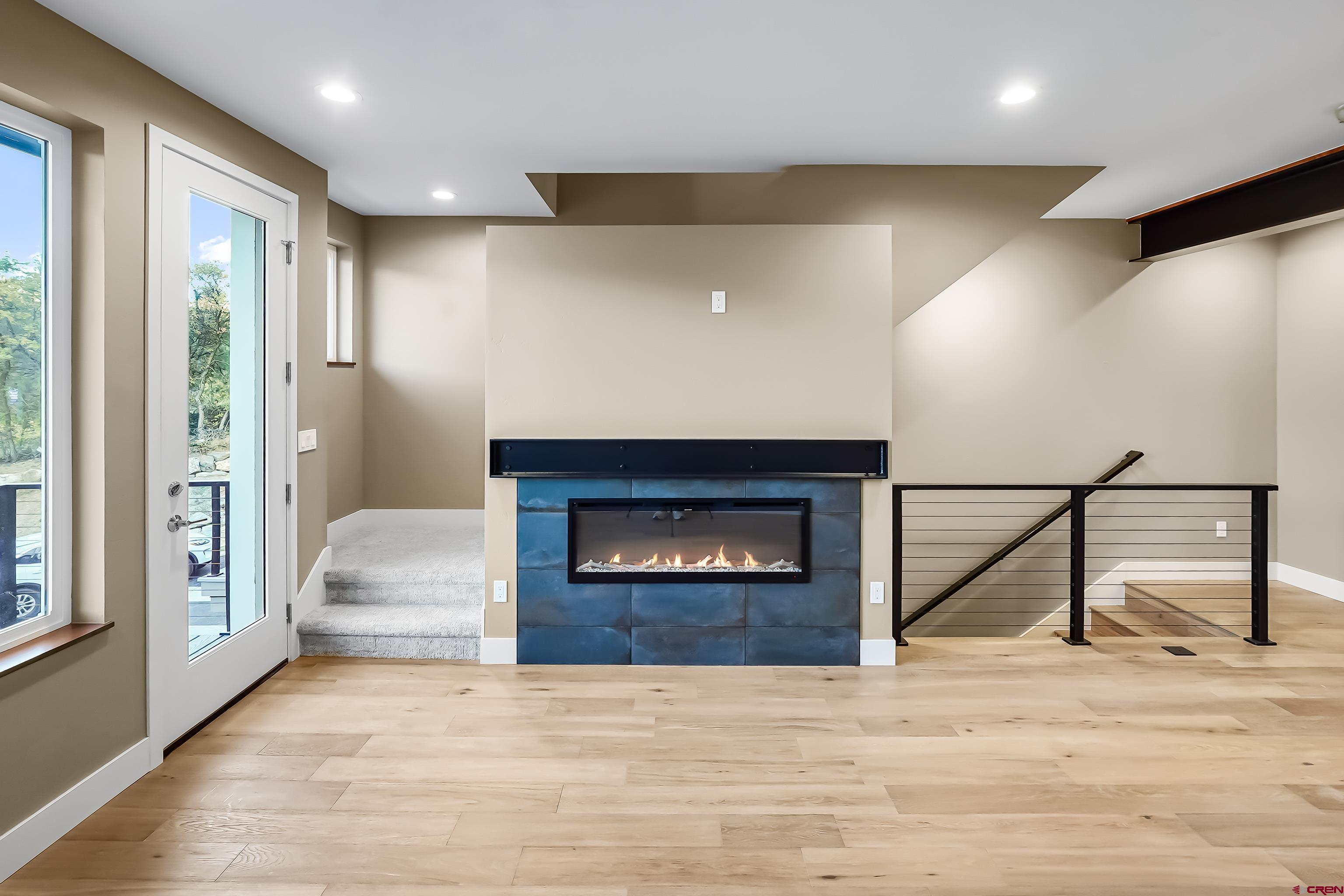 762 Goeglein Gulch Road, Unit 5 Durango, CO 81301 - Photo 18 of 43 a view of an empty room and fire place