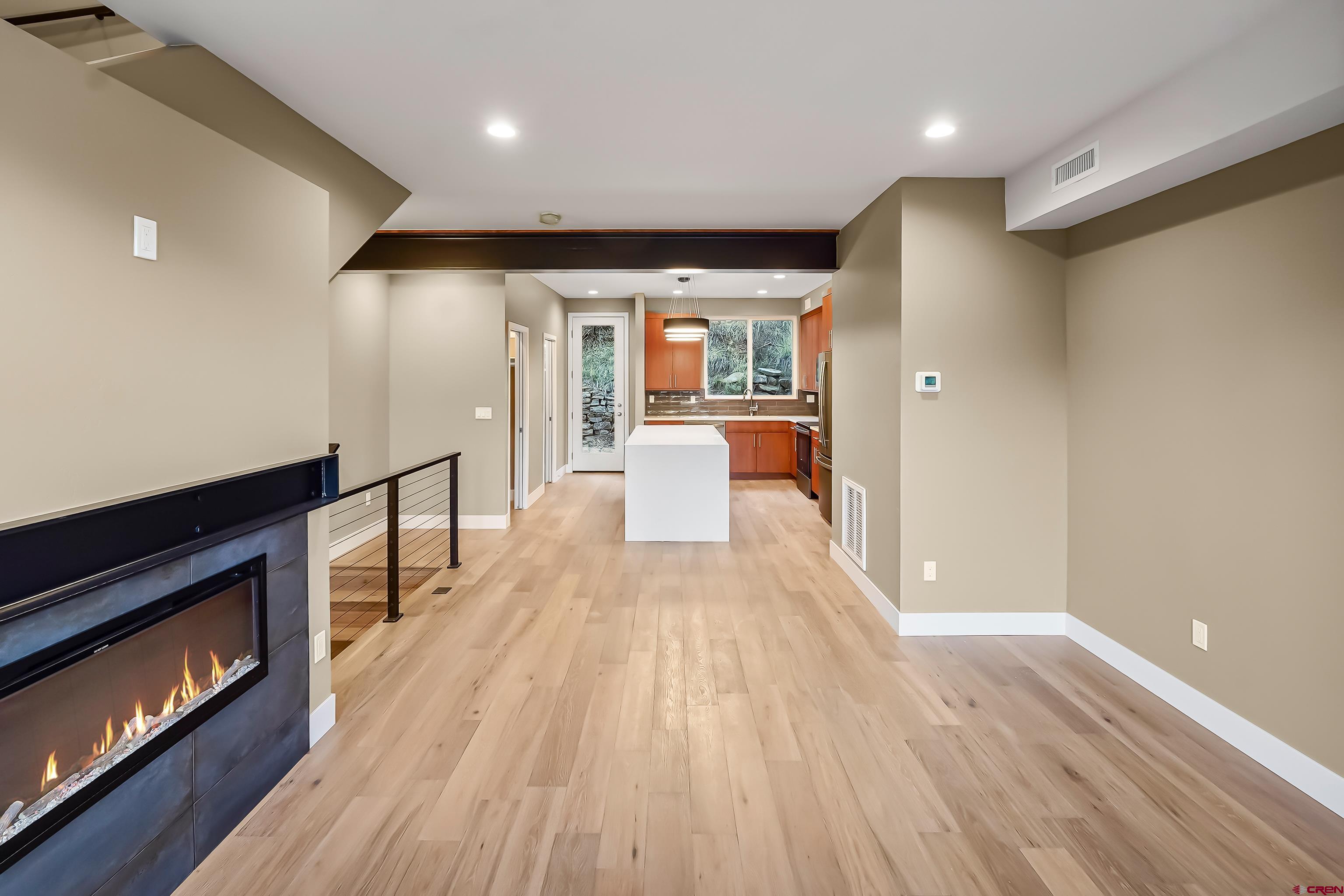 762 Goeglein Gulch Road, Unit 5 Durango, CO 81301 - Photo 19 of 43 a view of a room with wooden floor and staircase