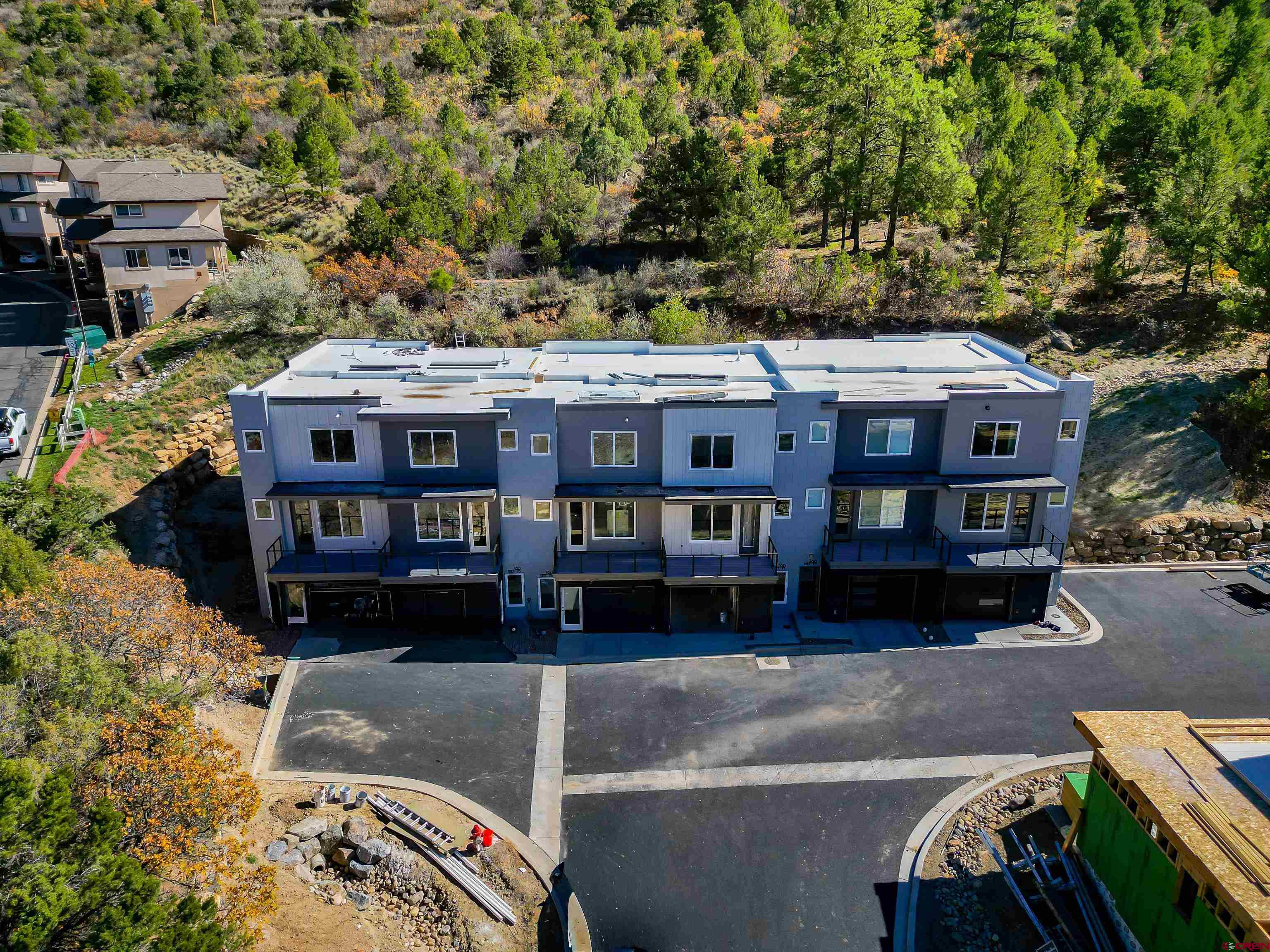 762 Goeglein Gulch Road, Unit 5 Durango, CO 81301 - Photo 2 of 43 an aerial view of a house with a yard in front of it
